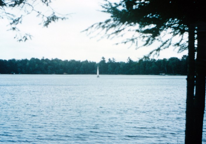 lake_machkinosiew_01 A sailboat races across Lake Machkinosiew (Enterprise Lake).